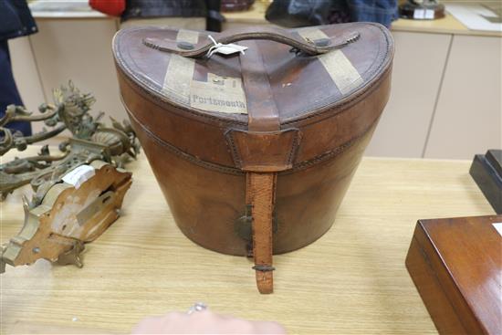 A Harrods black silk top hat, original fitted leather case, a Dunn & Co grey silk top hat and a fox fur stole